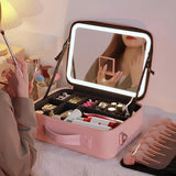 The case open on a bed, a full makeup kit in the tray